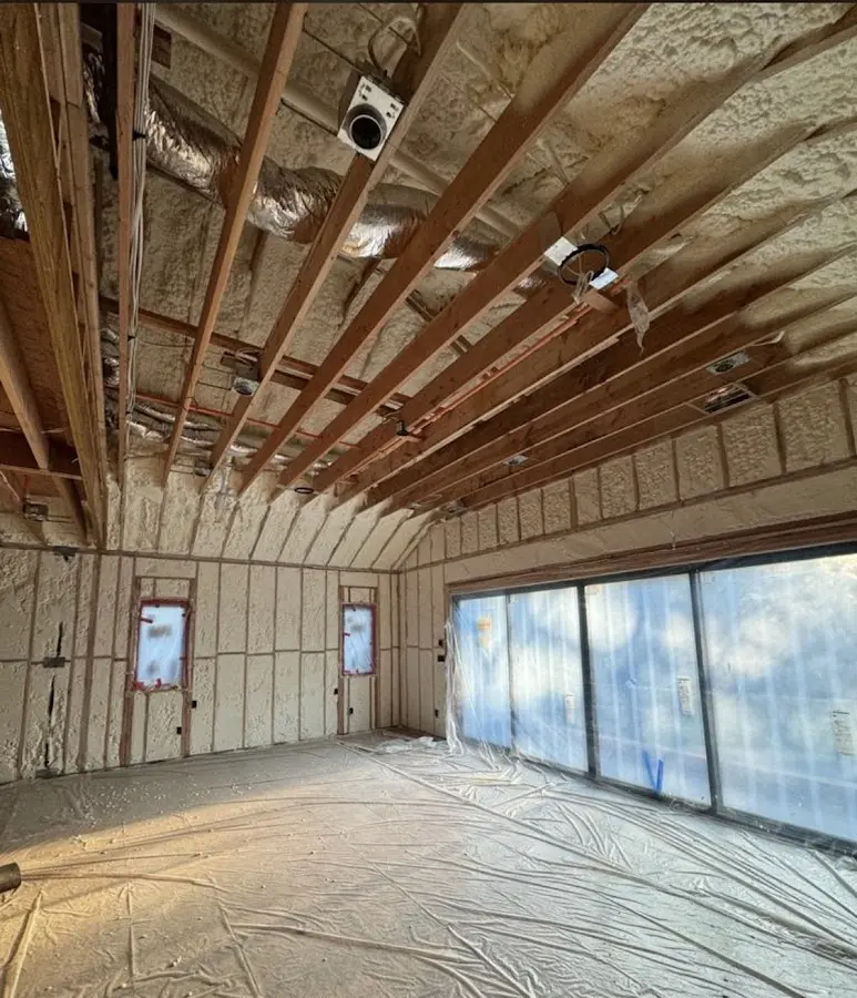 Interior walls and ceiling insulated with spray foam during new construction in Carlisle
